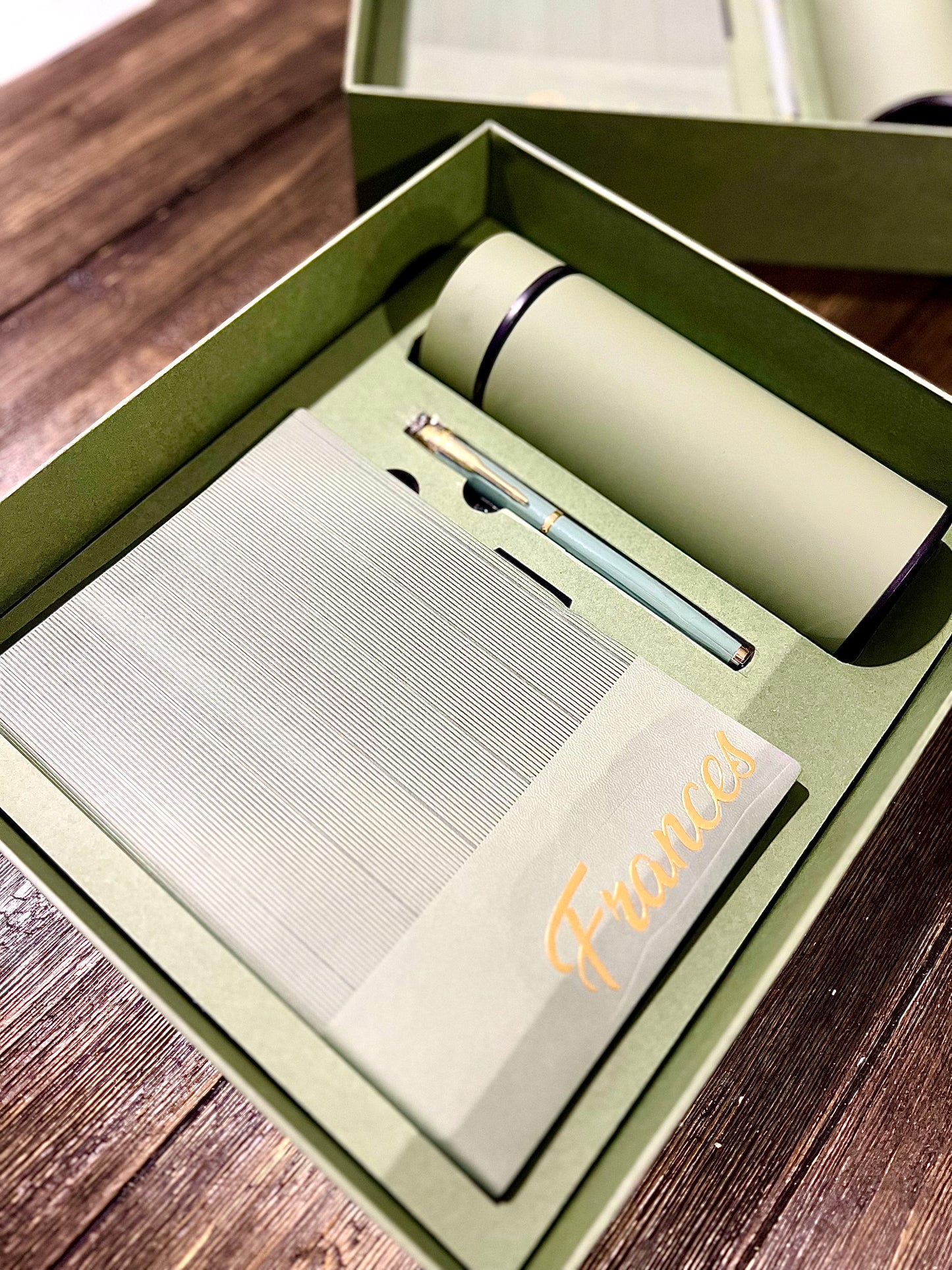 Notepad, tumbler and pen